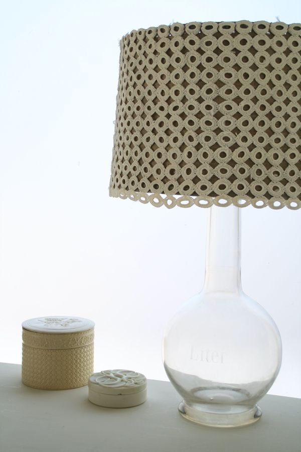 DIY lampshade wrapped with a table runner featuring connected crochet circles.