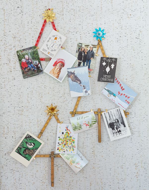 Vintage expandable rulers unfurled into tree-shape card holders for the holidays.