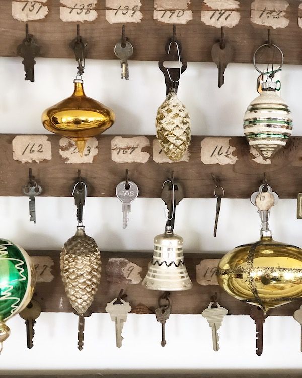 Vintage key rack displaying old ornaments.