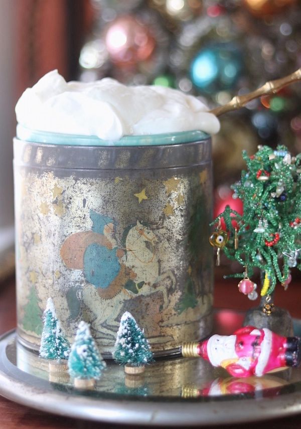 Vintage tin serving whipped cream at holiday party.