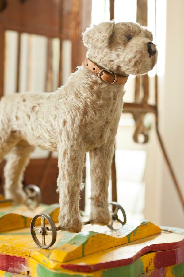 Vintage toy dog on wheels.