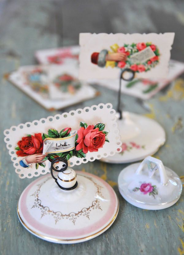 Vintage sugar bowl lids turned into photo or place card holders.