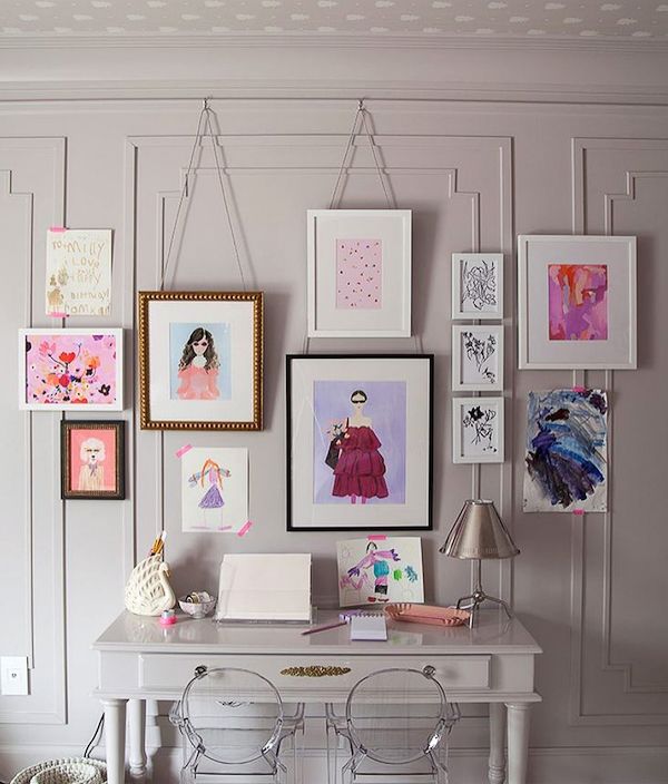 Children's framed art over painted vintage desk.