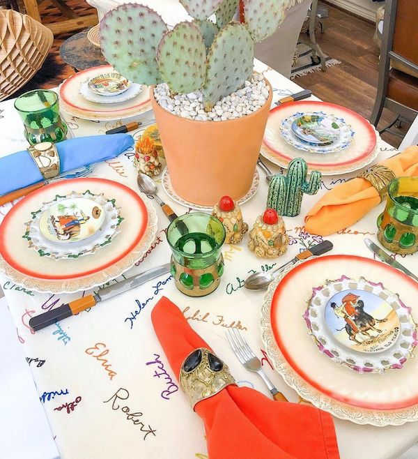 Vintage state plates used as decor on a table.