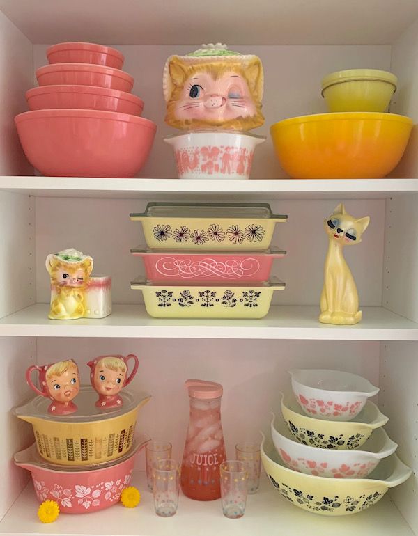 Collection of pink and yellow Pyrex.