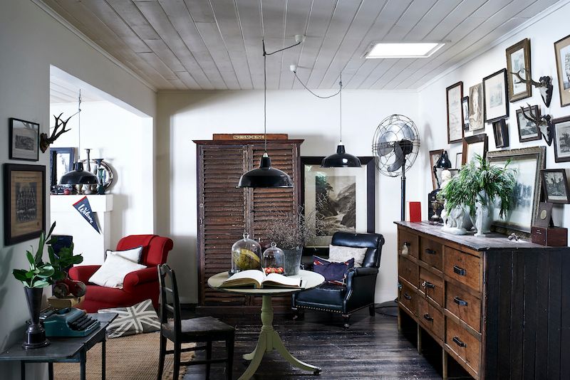 Annex to living room with large vintage and antique furniture.