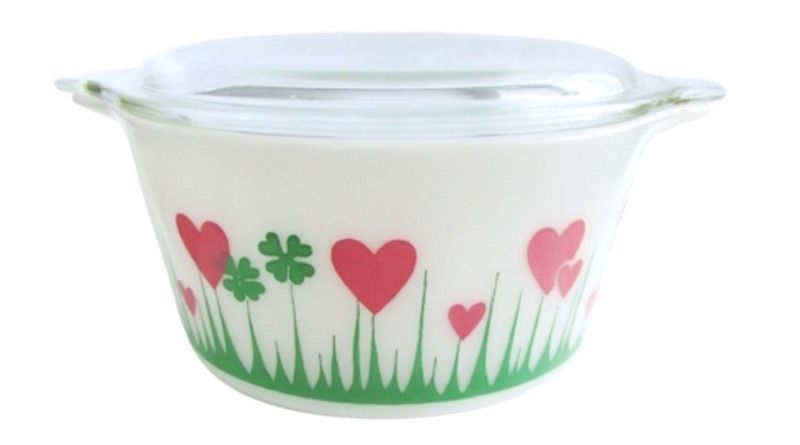 Pyrex dish with green four-leaf clovers and pink hearts.