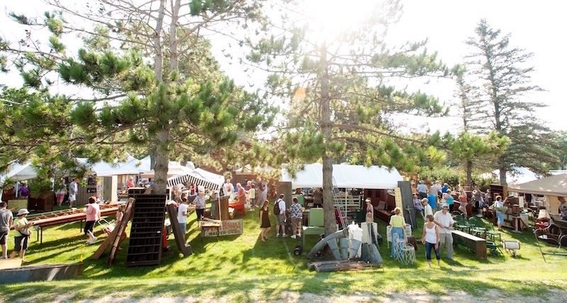 Image of booths at an outdoor flea market.