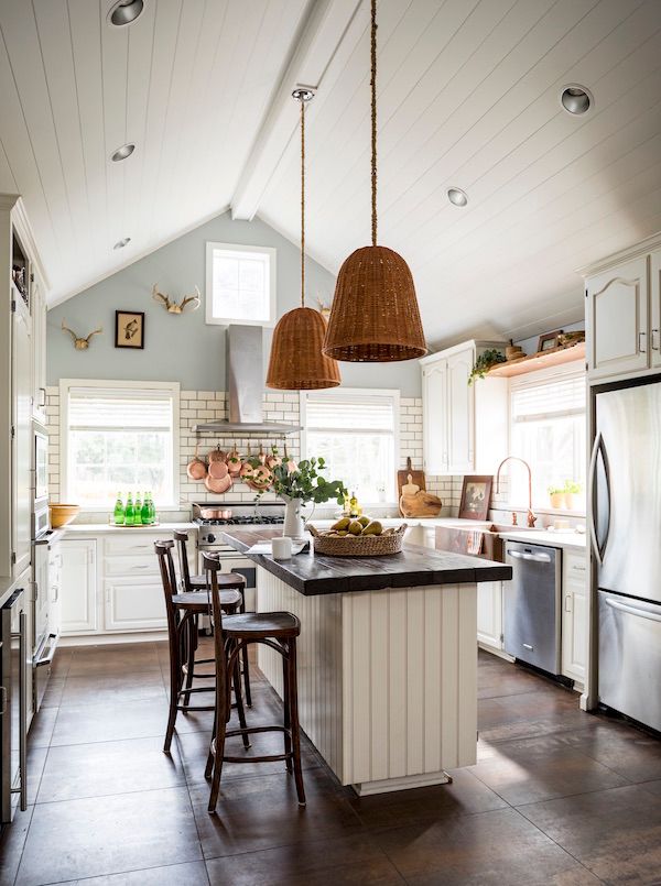Kitchen island made from reclaimed barn wood in farmhouse.