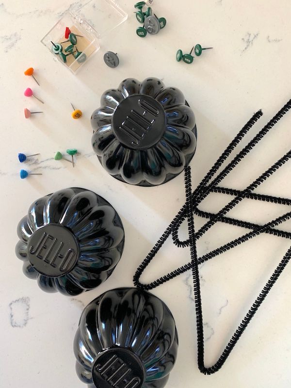 Materials needed to make vintage Jell-O molds into spiders.